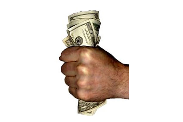 Hand clutching a money bundle featuring text.- Money Finder Biz.